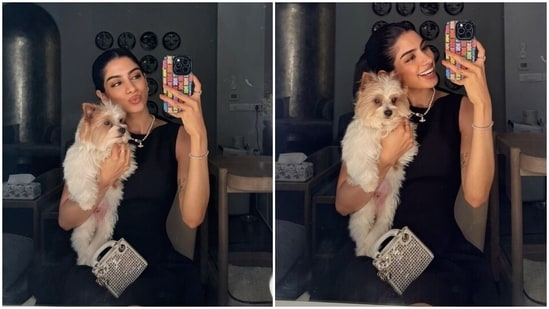 Khushi's LBD comes in a midnight black shade and features a sleeveless silhouette, a bateau neckline, a column bodice, a cinched waistline, a flared skirt with pleats, and a mini hem length that shows off her long legs. (Instagram)