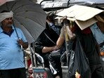 A man takes shelter under an umbrella from the scorching sun on a hot summer afternoon amid the ongoing heatwave. (AFP) A man takes shelter under an umbrella from the scorching sun on a hot summer afternoon amid the ongoing heatwave. (AFP)