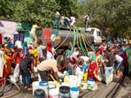 People collect drinking water from a tanker on a hot summer day at Vivekanand camp in New Delhi on May 28. People collect drinking water from a tanker on a hot summer day at Vivekanand camp in New Delhi on May 28.