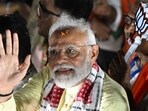 PM Narendra Modi (C) waves to supporters during an election campaign rally, in Kolkata. PM Narendra Modi (C) waves to supporters during an election campaign rally, in Kolkata.