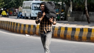 Noida, India- May 27, 2024: Commuters seen with their heads covered to protect them from the hot summer day at sector 38.The India Meteorological Department (IMD) on Sunday said that Delhi-NCR will continue experiencing a "severe heatwave" for the next three days and has issued a red alert in the area until May 29, in Noida, India, on Monday, May 27, 2024. (Photo by Sunil Ghosh / Hindustan Times) Noida, India- May 27, 2024: Commuters seen with their heads covered to protect them from the hot summer day at sector 38.The India Meteorological Department (IMD) on Sunday said that Delhi-NCR will continue experiencing a "severe heatwave" for the next three days and has issued a red alert in the area until May 29, in Noida, India, on Monday, May 27, 2024. (Photo by Sunil Ghosh / Hindustan Times)