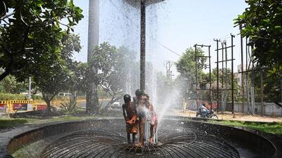 Children taking bath in water fountain in scorching heat in Noida Sector 34 on Tuesday. (HT Photo/Sunil Ghosh) Children taking bath in water fountain in scorching heat in Noida Sector 34 on Tuesday. (HT Photo/Sunil Ghosh)