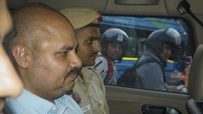 Delhi Police personnel and Bibhav Kumar leave Arvind Kejriwal's house in New Delhi on Monday. (PTI) Delhi Police personnel and Bibhav Kumar leave Arvind Kejriwal's house in New Delhi on Monday. (PTI)