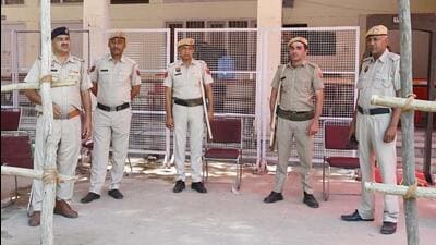 Haryana Police and Central Industrial Security Force (CISF) personnel stand guard outside a sealed strong room where electronic voting machines (EVM) are kept following the Lok Sabha election in Haryana. (Parveen Kumar/HT photo) Haryana Police and Central Industrial Security Force (CISF) personnel stand guard outside a sealed strong room where electronic voting machines (EVM) are kept following the Lok Sabha election in Haryana. (Parveen Kumar/HT photo)