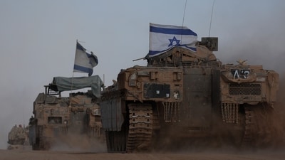 Israeli armoured personnel carriers (APC) operate, amid the ongoing conflict between Israel and the Palestinian Islamist group Hamas, near Israel's border with Gaza in southern Israel (REUTERS)