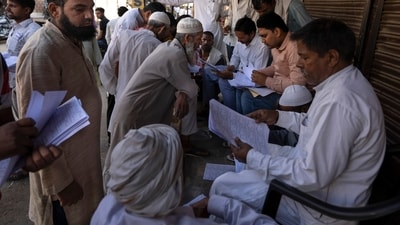 Muslims check for their names in voters' list as they arrive to vote in Nahal village, Uttar Pradesh state, India, on April 26, 2024. (AP Photo/Altaf Qadri) (AP) Muslims check for their names in voters' list as they arrive to vote in Nahal village, Uttar Pradesh state, India, on April 26, 2024. (AP Photo/Altaf Qadri) (AP)