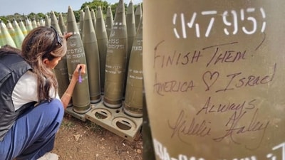 Nikki Haley seen writing a message on an Israeli shell to be used against people of Gaza Nikki Haley seen writing a message on an Israeli shell to be used against people of Gaza