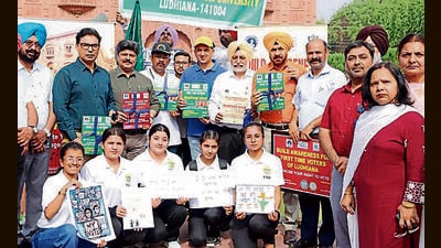 PAU V-C Satbir Singh Gosal with dignitaries and students an event to encourage first-time voters in Ludhiana on Wednesday. (HT)