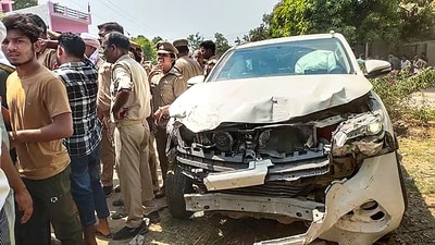 Police personnel near the wreckage of an escort vehicle, part of the convoy of Brij Bhushan Sharan Singh's son and BJP leader Karan Bhushan Singh, that allegedly hit a biker, in Gonda, Wednesday, (PTI) Police personnel near the wreckage of an escort vehicle, part of the convoy of Brij Bhushan Sharan Singh's son and BJP leader Karan Bhushan Singh, that allegedly hit a biker, in Gonda, Wednesday, (PTI)