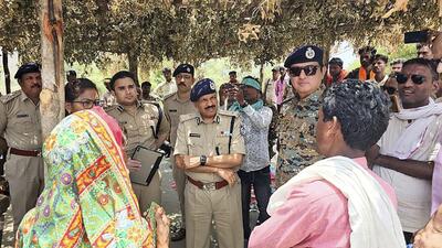 Senior police officials at the scene of the incident in the tribal village of Bodal Kachhar, Chhindwara district, Madhya Pradesh, on Wednesday. (PTI) Senior police officials at the scene of the incident in the tribal village of Bodal Kachhar, Chhindwara district, Madhya Pradesh, on Wednesday. (PTI)