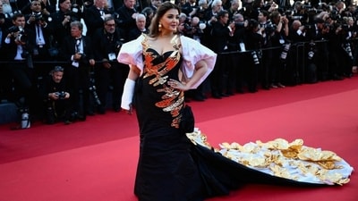 Indian designer Falguni Shane Peacock designed the gown in question. The ensemble, made in stiff fabric with puffy white sleeves and a long cape, featured 'velcro-ed' golden flower embellishments, golden foil details on the bodice, and gathered pleats on the front. (Instagram) Indian designer Falguni Shane Peacock designed the gown in question. The ensemble, made in stiff fabric with puffy white sleeves and a long cape, featured 'velcro-ed' golden flower embellishments, golden foil details on the bodice, and gathered pleats on the front. (Instagram)