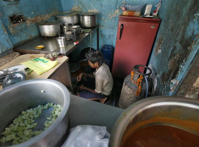 A boy working at an eatery in New Delhi. (Raj K Raj/Hindustan Times) A boy working at an eatery in New Delhi. (Raj K Raj/Hindustan Times)