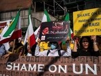 People protest outside the United Nations Headquarters before the United Nations General Assembly ceremonial tribute to Iran's President Ebrahim Raisi at the United Nations headquarters. (Reuters)