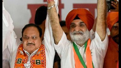 BJP president Jagat Prakash Nadda with party’s Amritsar candidate Taranjit Singh Sandhu during a poll campaign in Amritsar on Thursday. (AFP) BJP president Jagat Prakash Nadda with party’s Amritsar candidate Taranjit Singh Sandhu during a poll campaign in Amritsar on Thursday. (AFP)