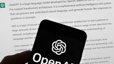 The OpenAI logo is seen on a mobile phone in front of a computer screen which displays output from ChatGPT. (AP) The OpenAI logo is seen on a mobile phone in front of a computer screen which displays output from ChatGPT. (AP)