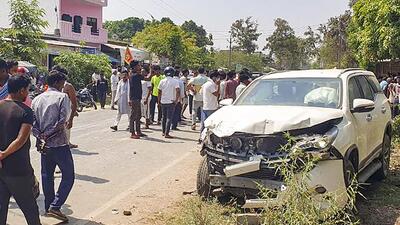 Gonda: People gather near the wreckage of an escort vehicle, part of the convoy of Brij Bhushan Sharan Singh's son and BJP leader Karan Bhushan Singh, that allegedly hit a biker, in Gonda, on May 29 (PTI) Gonda: People gather near the wreckage of an escort vehicle, part of the convoy of Brij Bhushan Sharan Singh's son and BJP leader Karan Bhushan Singh, that allegedly hit a biker, in Gonda, on May 29 (PTI)