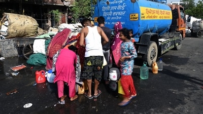 Residents collect water from a tanker during high temperatures in New Delhi, India, on Thursday, May 30, 2024. Temperatures at a weather observatory in India�s capital city touched 52.9C (127F) on Wednesday, evidence of a worsening heat wave that also sent peak electricity demand in Delhi to an all-time high. Photographer: Prakash Singh/Bloomberg (Bloomberg) Residents collect water from a tanker during high temperatures in New Delhi, India, on Thursday, May 30, 2024. Temperatures at a weather observatory in India�s capital city touched 52.9C (127F) on Wednesday, evidence of a worsening heat wave that also sent peak electricity demand in Delhi to an all-time high. Photographer: Prakash Singh/Bloomberg (Bloomberg)