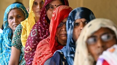 Women queue up to cast their ballots at a polling station during the sixth phase of voting in India�s general election, in village Tigaon on the outskirts of Faridabad on May 25, 2024. India is voting in seven phases over six weeks to ease the immense logistical burden of staging an election in the world's most populous country. (Photo by Money SHARMA / AFP) (AFP) Women queue up to cast their ballots at a polling station during the sixth phase of voting in India�s general election, in village Tigaon on the outskirts of Faridabad on May 25, 2024. India is voting in seven phases over six weeks to ease the immense logistical burden of staging an election in the world's most populous country. (Photo by Money SHARMA / AFP) (AFP)