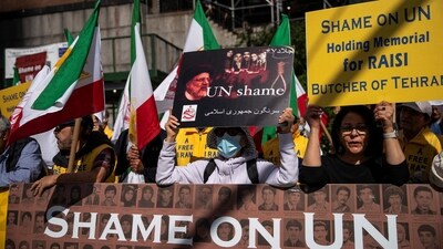 People protest outside the United Nations Headquarters before the United Nations General Assembly ceremonial tribute to Iran's President Ebrahim Raisi at the United Nations headquarters. (Reuters)