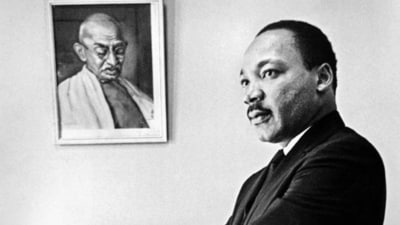 Dr Martin Luther King, Jr stands next to a portrait of Mahatma Gandhi in his office in 1966. (Bob Fitch Photography Archive, Department of Special Collections, Stanford University Libraries) Dr Martin Luther King, Jr stands next to a portrait of Mahatma Gandhi in his office in 1966. (Bob Fitch Photography Archive, Department of Special Collections, Stanford University Libraries)