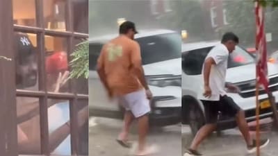 Rohit Sharma and Rahul Dravid sprint to a cab in the rain. Rohit Sharma and Rahul Dravid sprint to a cab in the rain.