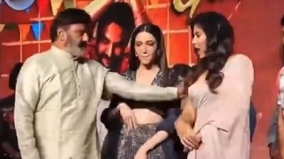 Nandamuri Balakrishna pushes co-star Anjali at a promotional event Nandamuri Balakrishna pushes co-star Anjali at a promotional event
