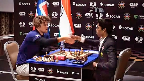 Indian Grandmaster R Praggnanandhaa and Norway's Grandmaster and World No. 1 player Magnus Carlsen during a match. (PTI)