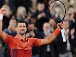 Serbia's Novak Djokovic celebrates after winning against Spain's Roberto Carballes Baena.