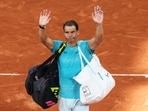Rafael Nadal gestures to the public as he leaves the court. Rafael Nadal gestures to the public as he leaves the court.
