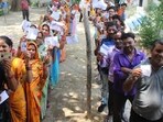 Voters standing in a queue to cast their vote at a polling station during Lok Sabha election. (HT Photo)