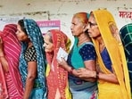 Women stand in a queue to cast their votes at a polling station in Saroi village, Bhadohi on Saturday (AFP PHOTO) Women stand in a queue to cast their votes at a polling station in Saroi village, Bhadohi on Saturday (AFP PHOTO)