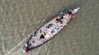Polling officials travel by boat to their polling booths ahead of voting in the seventh and final phase of Lok Sabha elections in North 24 Parganas district of West Bengal. (PTI) Polling officials travel by boat to their polling booths ahead of voting in the seventh and final phase of Lok Sabha elections in North 24 Parganas district of West Bengal. (PTI)