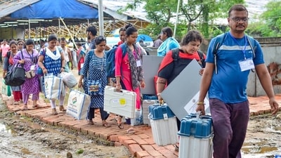 Polling officials carrying EVMs and other polling materials leave for their polling booths in North 24 Parganas, West Bengal. (ANI) Polling officials carrying EVMs and other polling materials leave for their polling booths in North 24 Parganas, West Bengal. (ANI)