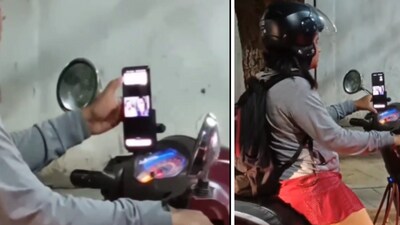 Bengaluru: A video shows a woman two-wheeler rider attending a call while stuck in traffic. (X/ @Sun46982817Shan) Bengaluru: A video shows a woman two-wheeler rider attending a call while stuck in traffic. (X/ @Sun46982817Shan)
