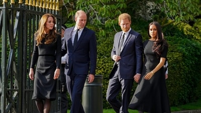 FILE - Britain's Prince William, second left, Kate, Princess of Wales, left, Britain's Prince Harry, second right, and Meghan, Duchess of Sussex view the floral tributes for the late Queen Elizabeth II outside Windsor Castle, in Windsor, England on Sept. 10, 2022. (AP Photo/Martin Meissner, File) (AP) FILE - Britain's Prince William, second left, Kate, Princess of Wales, left, Britain's Prince Harry, second right, and Meghan, Duchess of Sussex view the floral tributes for the late Queen Elizabeth II outside Windsor Castle, in Windsor, England on Sept. 10, 2022. (AP Photo/Martin Meissner, File) (AP)