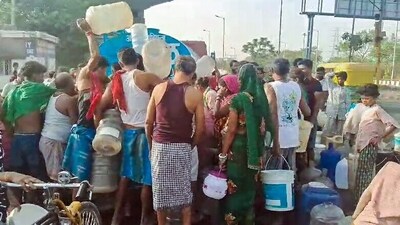 People collect water from the tanker due to the water crisis in the national capital, at Geeta Colony area, in New Delhi. (ANI)
