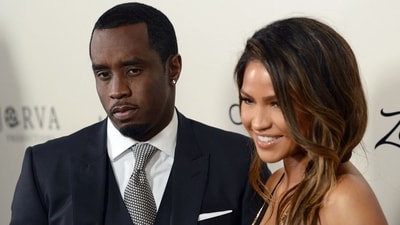 (FILES) Sean P. Diddy Combs with Cassie Ventura attend the premiere of 'The Perfect Match' at the Arclight Theatre in Los Angeles on March 7, 2016. Rapper Sean "Diddy" Combs apologized on May 19, 2024 after surveillance video surfaced showing him physically assaulting his then-girlfriend Casandra Ventura in 2016. Combs is the target of several civil lawsuits that characterize him as a violent sexual predator who used alcohol and drugs to subdue his victims, and his homes were raided this year by federal agents. (Photo by Chris Delmas / AFP) (AFP)