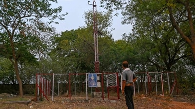 A man stands near an automatic weather station at dusk on a hot summer day in Mungeshpur, a suburb in New Delhi on May 29, 2024, amid the ongoing heatwave. Power usage in India's capital surged to a record high Wednesday as residents of the sprawling megacity struggled to keep cool during a crushing heatwave with temperatures sizzling above 45 degrees Celsius (over 113 Fahrenheit). (Photo by Arun SANKAR / AFP) (AFP) A man stands near an automatic weather station at dusk on a hot summer day in Mungeshpur, a suburb in New Delhi on May 29, 2024, amid the ongoing heatwave. Power usage in India's capital surged to a record high Wednesday as residents of the sprawling megacity struggled to keep cool during a crushing heatwave with temperatures sizzling above 45 degrees Celsius (over 113 Fahrenheit). (Photo by Arun SANKAR / AFP) (AFP)
