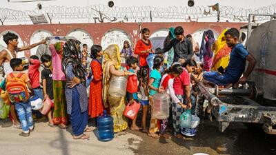 People queue up to fill water from a DJB tanker New Ashok Nagar, Delhi, on Friday. (Raj K Raj/HT Photo) People queue up to fill water from a DJB tanker New Ashok Nagar, Delhi, on Friday. (Raj K Raj/HT Photo)