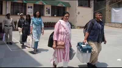 Poll officials with EVMs on the eve of the polling, in Shimla on Friday. (Deepak Sansta/HT) Poll officials with EVMs on the eve of the polling, in Shimla on Friday. (Deepak Sansta/HT)
