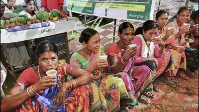 Women voters hydrate themselves during polling in Odisha. (PTI Photo) Women voters hydrate themselves during polling in Odisha. (PTI Photo)