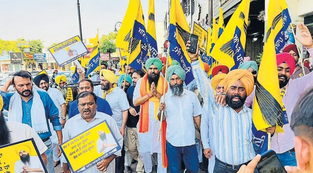AAP’s Anandpur Sahib candidate Malvinder Singh Kang during a foot march on Thursday. (HT photo)