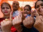 Voters show their index fingers marked with indelible ink after casting their ballots to vote at a polling station in Amritsar on June 1, 2024, during the seventh and final phase of voting in Lok Sabha elections. (AFP)
