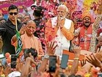 Prime Minister Narendra Modi and chief minister Yogi Adityanath during a road show in Varanasi on May 13. (AFP File Photo)