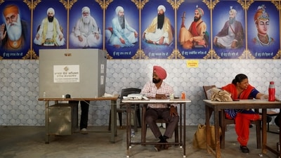 Polling officials are seen at a polling station as a man casts his vote in Faridkot, Punjab. (Adnan Abidi / Reuters) Polling officials are seen at a polling station as a man casts his vote in Faridkot, Punjab. (Adnan Abidi / Reuters)