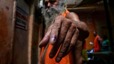 A Hindu priest shows his ink-marked finger after voting in Varanasi, Uttar Pradesh. (Niharika Kulkarni / AFP) A Hindu priest shows his ink-marked finger after voting in Varanasi, Uttar Pradesh. (Niharika Kulkarni / AFP)