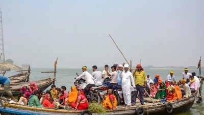 Voters show their ink-marked fingers as they ride a boat to cross the Ganga river after voting in Patna, Bihar. (PTI) Voters show their ink-marked fingers as they ride a boat to cross the Ganga river after voting in Patna, Bihar. (PTI)