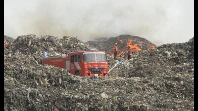 Firefighters trying to control the fire at the Bandhwari landfill on the Gurugram-Faridabad Road in Gurugram on Saturday. (Parveen Kumar/HT PHOTO) Firefighters trying to control the fire at the Bandhwari landfill on the Gurugram-Faridabad Road in Gurugram on Saturday. (Parveen Kumar/HT PHOTO)