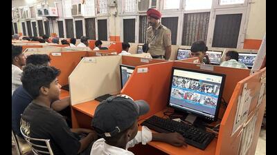 Government school students keeping an eye on poll officials through live webcasting of polling booths in Patiala on Saturday. (HT Photo) Government school students keeping an eye on poll officials through live webcasting of polling booths in Patiala on Saturday. (HT Photo)