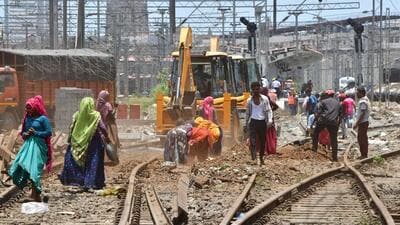 Labourers work for the extension of platforms 10 and 11 to accommodate 24-coach trains, at CSMT, during the 36-hour Mega Block by Central Railway on Saturday. (Bhushan Koyande/HT Photo) Labourers work for the extension of platforms 10 and 11 to accommodate 24-coach trains, at CSMT, during the 36-hour Mega Block by Central Railway on Saturday. (Bhushan Koyande/HT Photo)